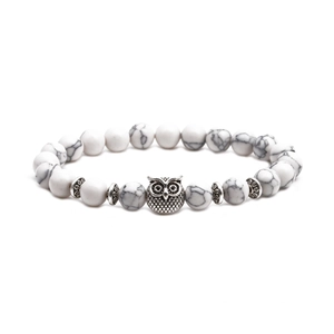 White turquoise beaded owl bracelet with marble texture and silver metallic accents