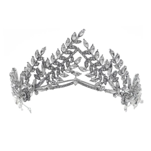 Detailed close-up of a silver bridal crown with leaf patterns and shimmering clear zircons