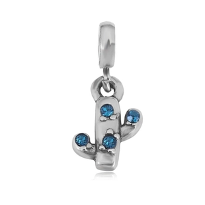 Detailed view of a silver cactus charm pendant with four inlaid blue gemstones