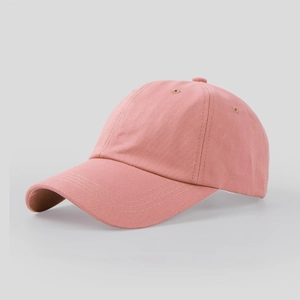 Detailed macro view of pink cotton twill baseball cap with classic six-panel stitching