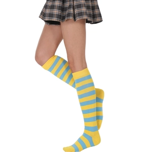 Detail of yellow and blue striped over-the-knee socks showing knit texture and elasticity