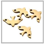Detailed view of four golden bird-shaped metal charms with dual-hole DIY connectors