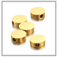 Macro detail of gold plated spacer beads with side holes for DIY jewelry making