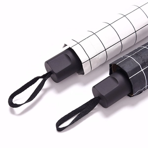 Classic checkered folding sun umbrella with matte black handle and braided lanyard