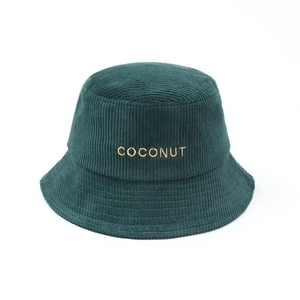 Close-up of dark green corduroy bucket hat with COCONUT letter embroidery detail