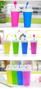 Detail of colorful silicone squeeze slushy cups with dome lids and matching straw spoons
