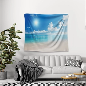 Detail of beach scenery tapestry featuring sunny blue sky over a modern grey sofa