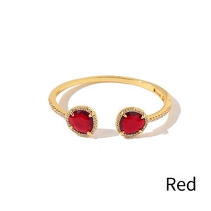 Golden open cuff bracelet with geometric red crystal and pave diamond accents