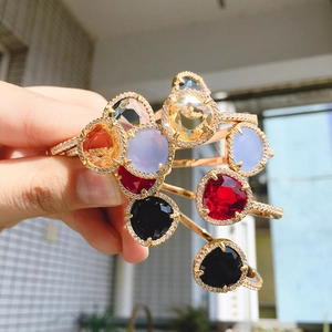 Colorful gemstone open bracelets with faceted crystals and paved zircons in gold plating