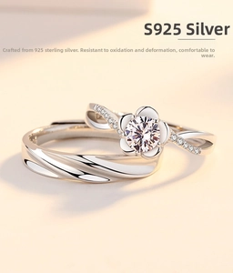 Detailed macro shot of S925 sterling silver couple rings with flower set diamond and textures