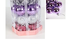 Detail of assorted shiny and matte Christmas ornaments in a hexagonal gift box