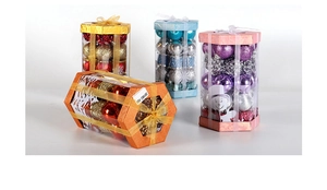 Detail of hexagonal Christmas ball gift boxes with glitter ornaments and silk ribbons