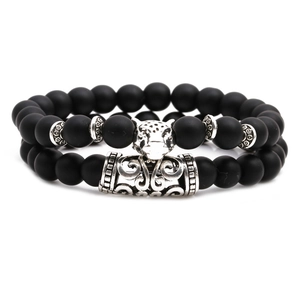 Matte black stone bead bracelet set with silver jaguar head and totem metal tube accents