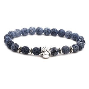 Detailed view of blue veined agate bead bracelet with a silver leopard head charm