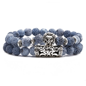 Double-layered beaded bracelet with weathered stone beads and a silver lion head charm