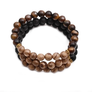 Beaded bracelet with 8mm wenge wood, tiger eye, and volcanic stone on white background