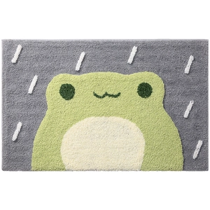 Absorbent plush bathroom mat with a cute green cartoon frog design on a gray background