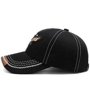 Men's black baseball cap with eagle embroidery and brown leather trim on visor