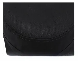 Close-up of black flat top cap with double-stitched seams and durable cotton twill texture
