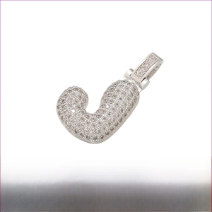 Close-up of rhodium plated brass letter J pendant with micro-paved cubic zirconia stones