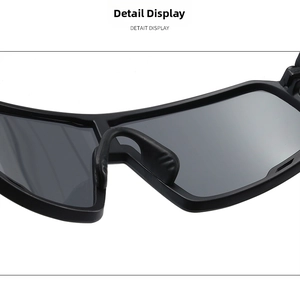 Detail view of anti-slip nose pads and large black lenses on sports sunglasses