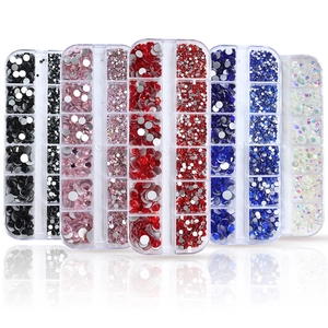 Five organizers with assorted colorful nail rhinestones in black, pink, red, and blue shades