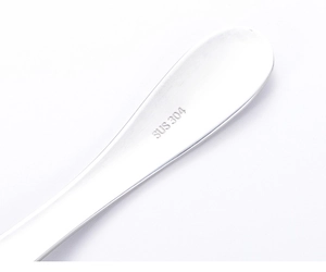 Macro shot of SUS 304 stainless steel hallmark engraved on the handle of child spoon