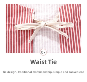 Detail of red and white striped apron featuring a cream cotton waist tie bow