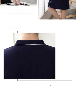 Close-up of navy waffle textured warm cashmere bathrobe with elegant white piping detail