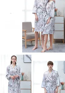 Detailed view of floral satin couple bathrobes with waist ties in light blue finish