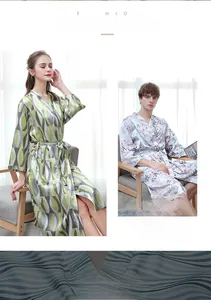 Detail of silk-like ice silk robes showing abstract green and purple floral patterns