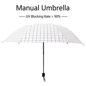 Manual folding umbrella with black and white grid pattern featuring 90% UV protection