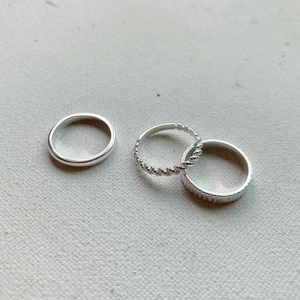 Minimalist S925 sterling silver ring set including smooth, rope, and striped bands