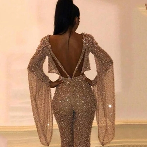 Sexy backless gold sequin jumpsuit with long flared sleeves for evening party wear