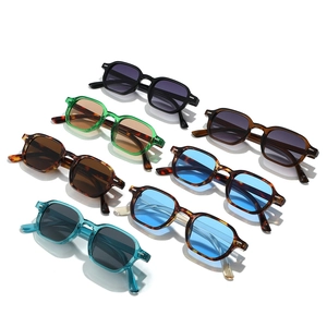 Collection of seven retro square frame sunglasses in various colors on white background
