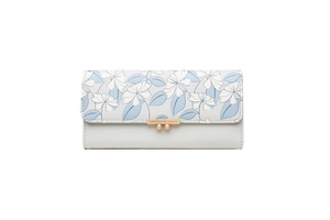 Detail of floral pattern on grey PU leather flap with gold metal buckle on long wallet