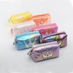 Detailed view of colorful laser iridescent cosmetic bags with crown emblem