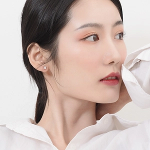Elegant 925 sterling silver square stud earrings with zircon stone on female model