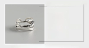Macro detail of S925 sterling silver ring showing irregular layered wave lines and 13mm width