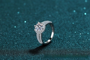 Macro shot of S925 sterling silver stamp and double row diamond pavé on the ring band
