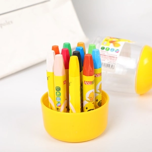 Detail of colorful oil pastel crayons in a storage base with a transparent plastic barrel