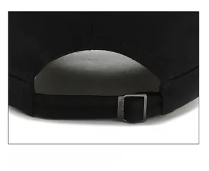 Detail shot of black twill baseball cap with adjustable metal buckle and stitching