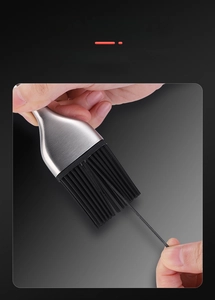 Macro shot of resilient black silicone bristles and 304 stainless steel handle kitchen brush