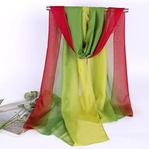 Detail of red green and yellow gradient long scarf with light transparent georgette texture