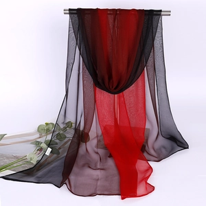 Detail of red and black gradient 100% silk scarf hanging with elegant drape and texture