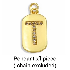 Macro shot of gold rectangular pendant featuring a crystal encrusted letter T design