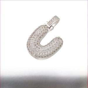 Rhodium-plated brass bubble letter U pendant with iced out pavé cubic zirconia