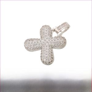 Macro detail of iced-out rhodium plated brass cross pendant measuring 20mm by 29mm
