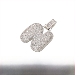 Close-up of hip hop bubble letter N pendant with white cubic zirconia in rhodium finish