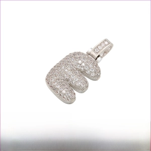 Macro detail of Rhodium-plated Brass Letter E pendant with pave-set zircon stones